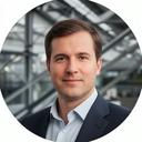 Manufacturing executive portrait in a modern plant office with structural steel in the background